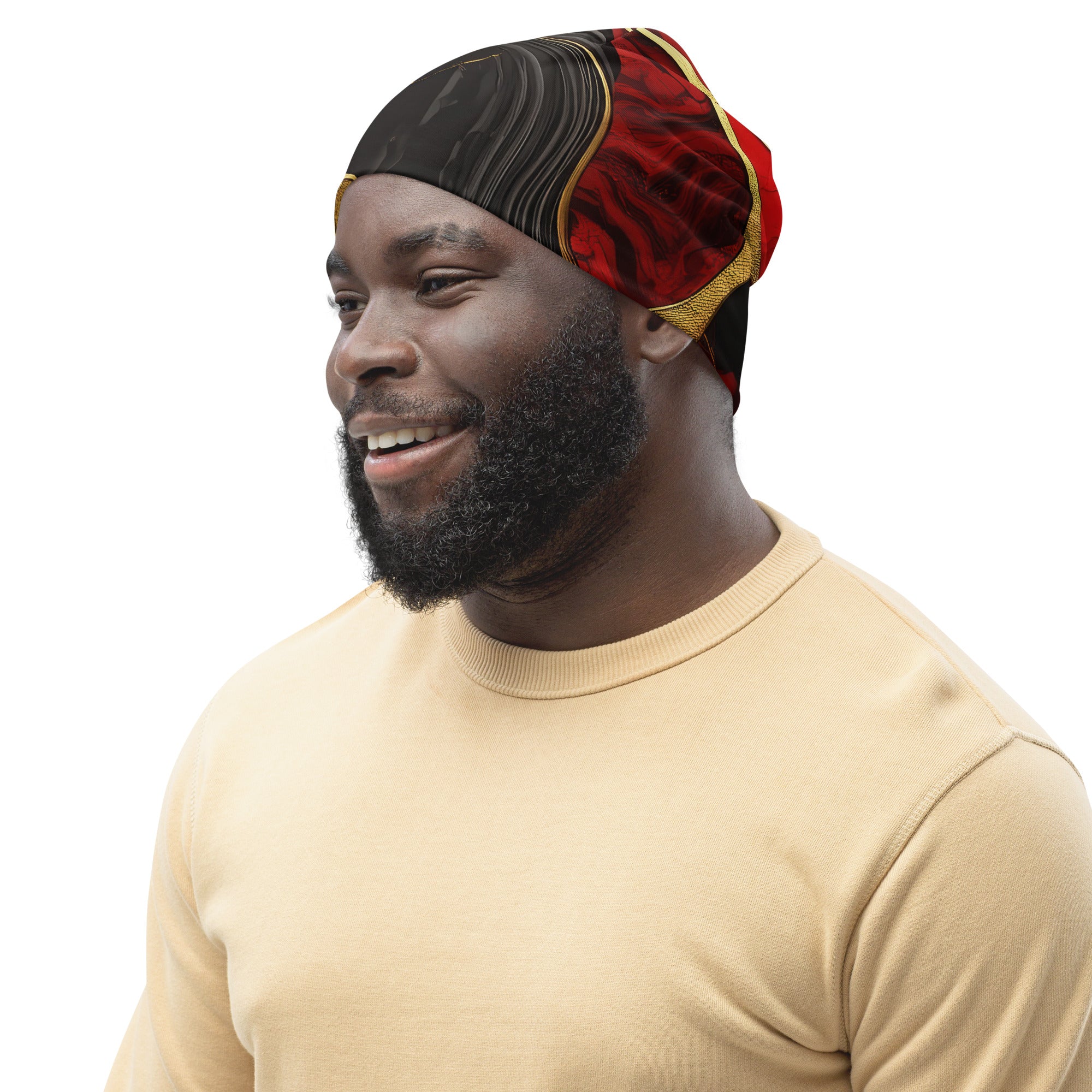 A vibrant double-layered beanie hat featuring bold red and gold tones print, perfect for winter and spring wear.