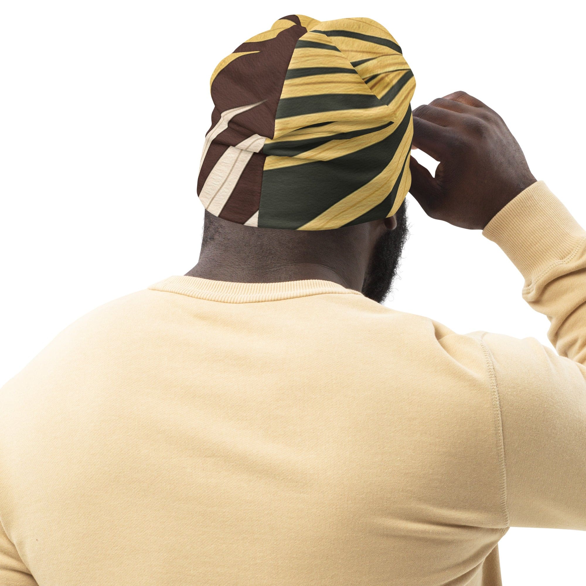 Double-layered beanie hat featuring a palm tree leaves pattern, showcasing its stylish design and soft fabric.