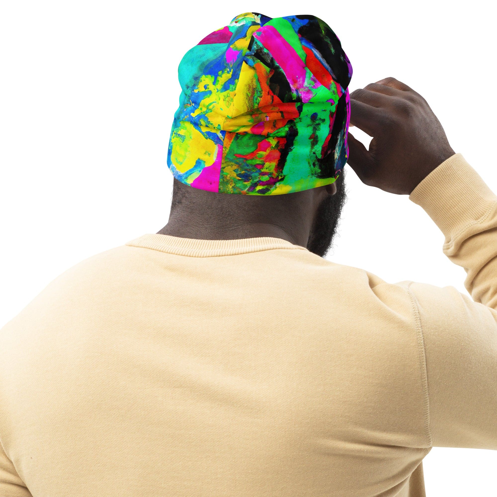 Double-layered beanie hat in red multicolor abstract print, showcasing its vibrant design and soft fabric.