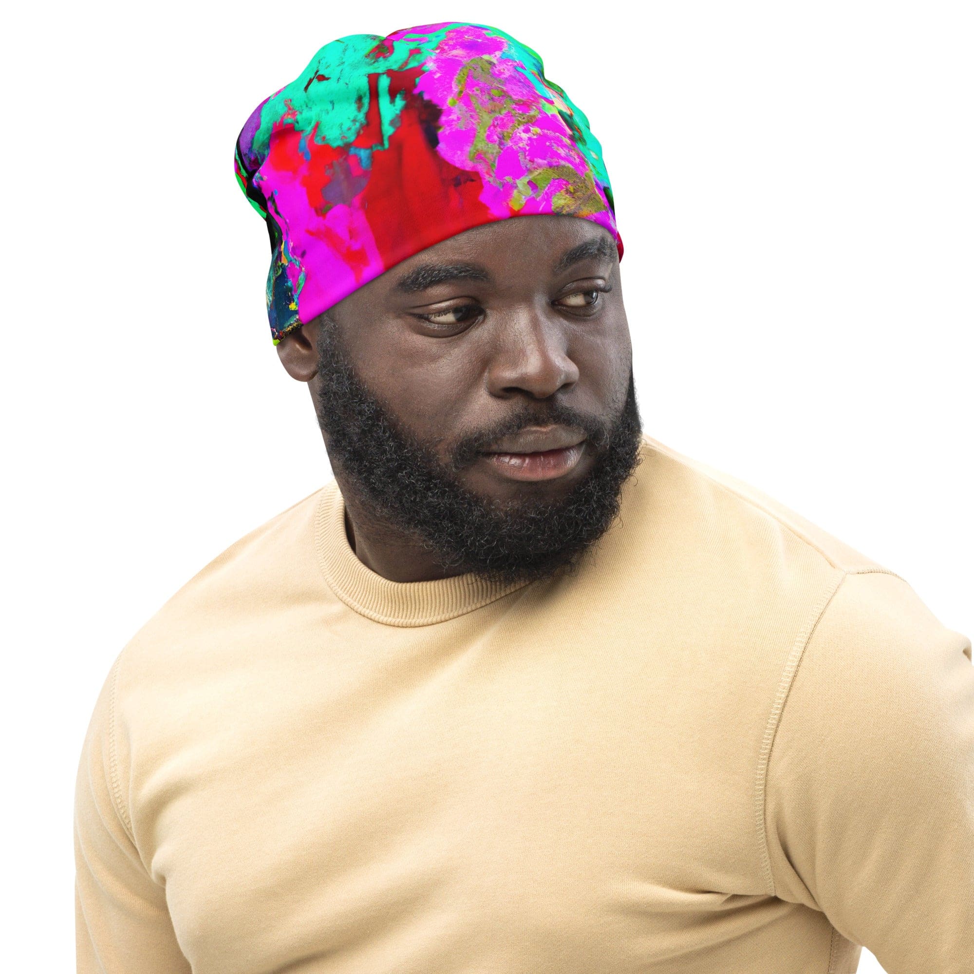 Double-layered beanie hat in red multicolor abstract print, showcasing its vibrant design and soft fabric.