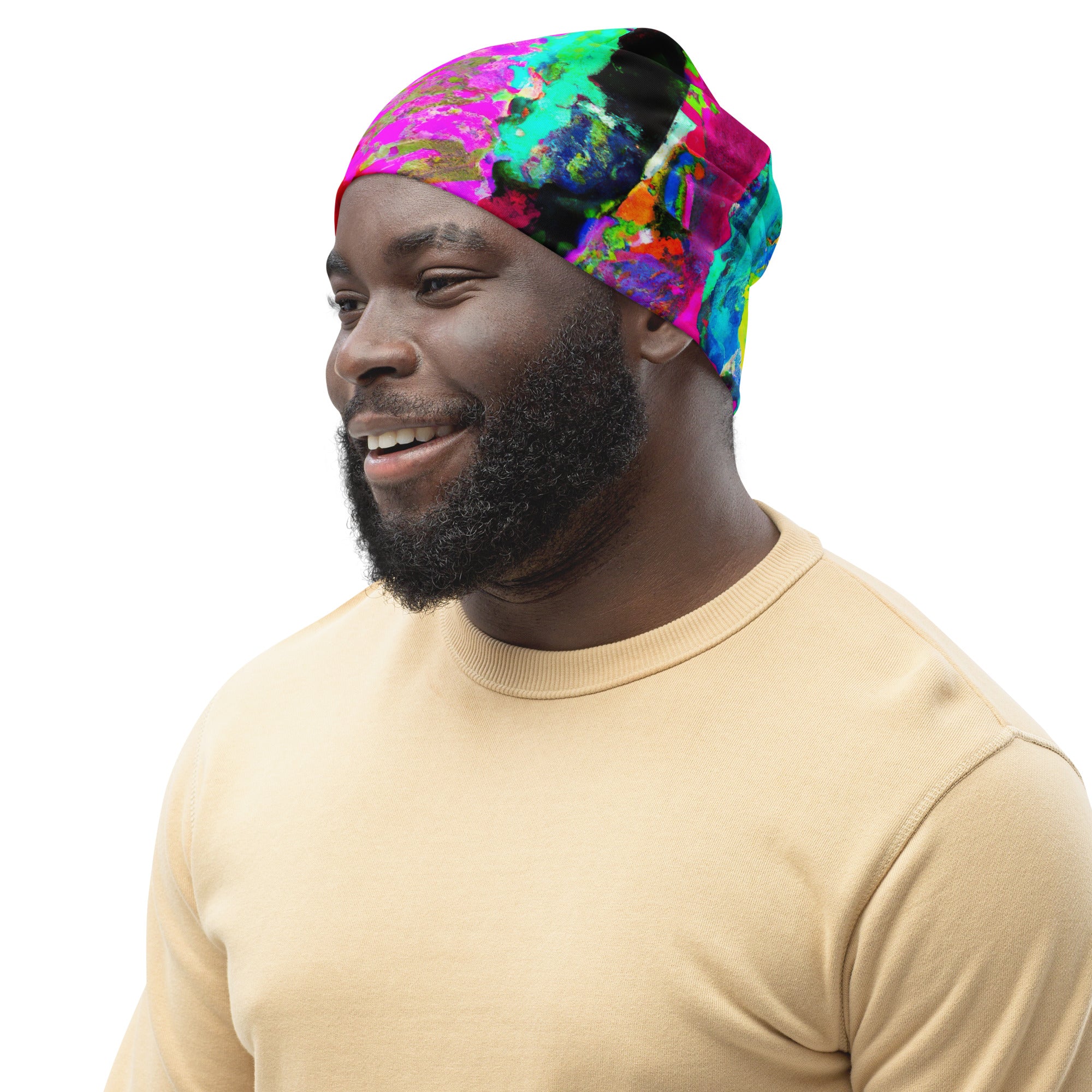 Double-layered beanie hat in red multicolor abstract print, showcasing its vibrant design and soft fabric.