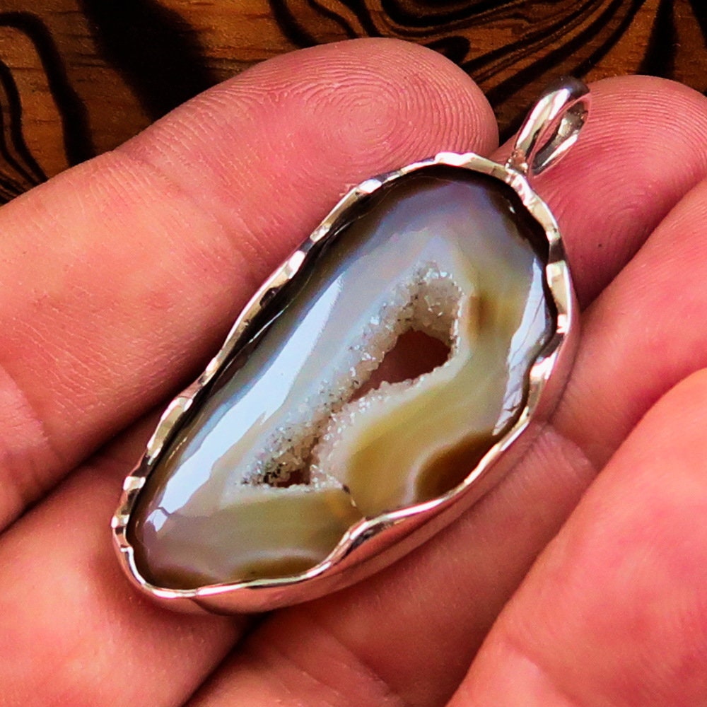 Druzy Agate Necklace featuring a honey-colored Agate stone in a sterling silver pendant, showcasing its elegant design.