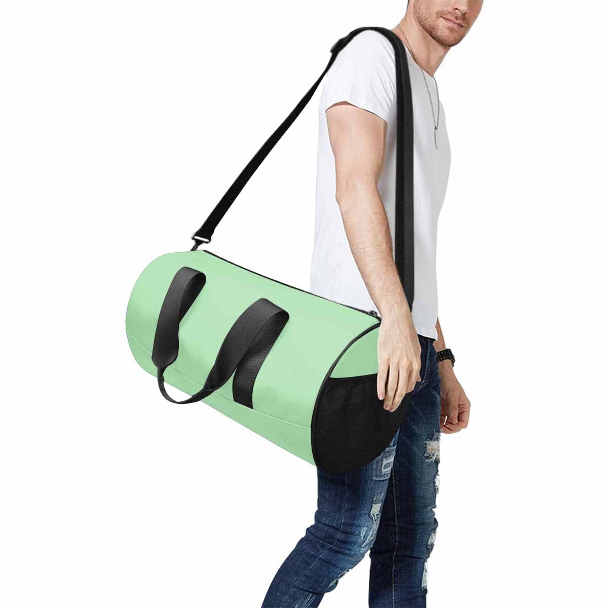 Celadon Green Duffel Bag designed for travel and outdoor activities, featuring waterproof fabric and spacious compartments.