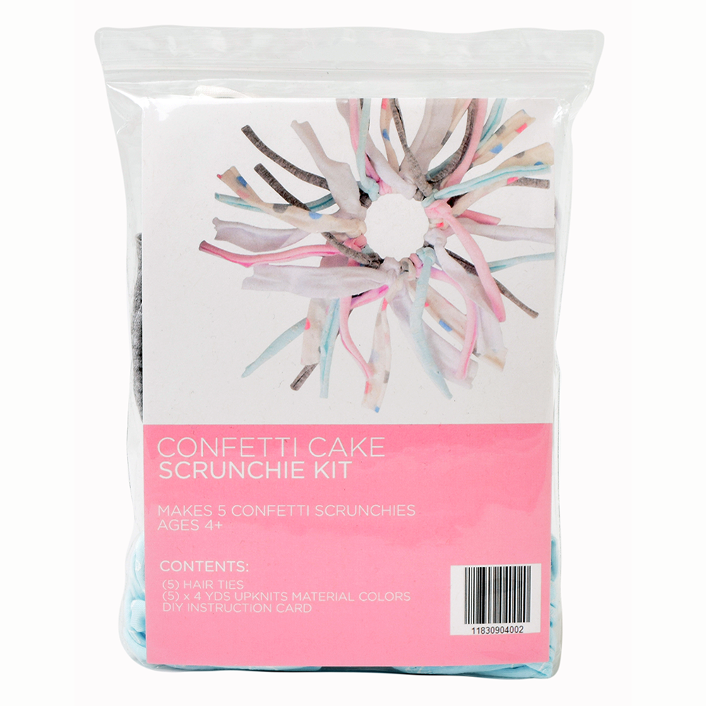 Eco DIY Scrunchie Kit featuring colorful upcycled materials and hair ties for crafting stylish scrunchies.