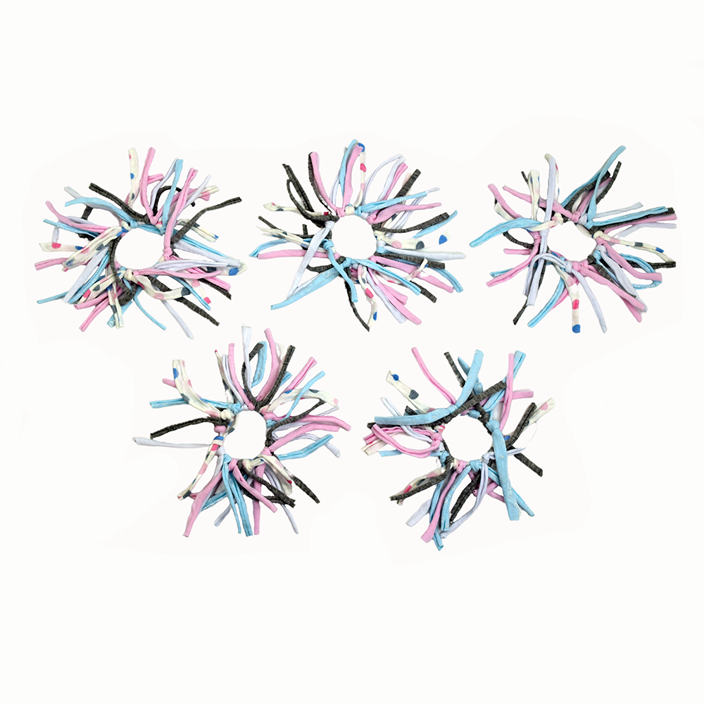 Eco DIY Scrunchie Kit featuring colorful upcycled materials and hair ties for crafting stylish scrunchies.