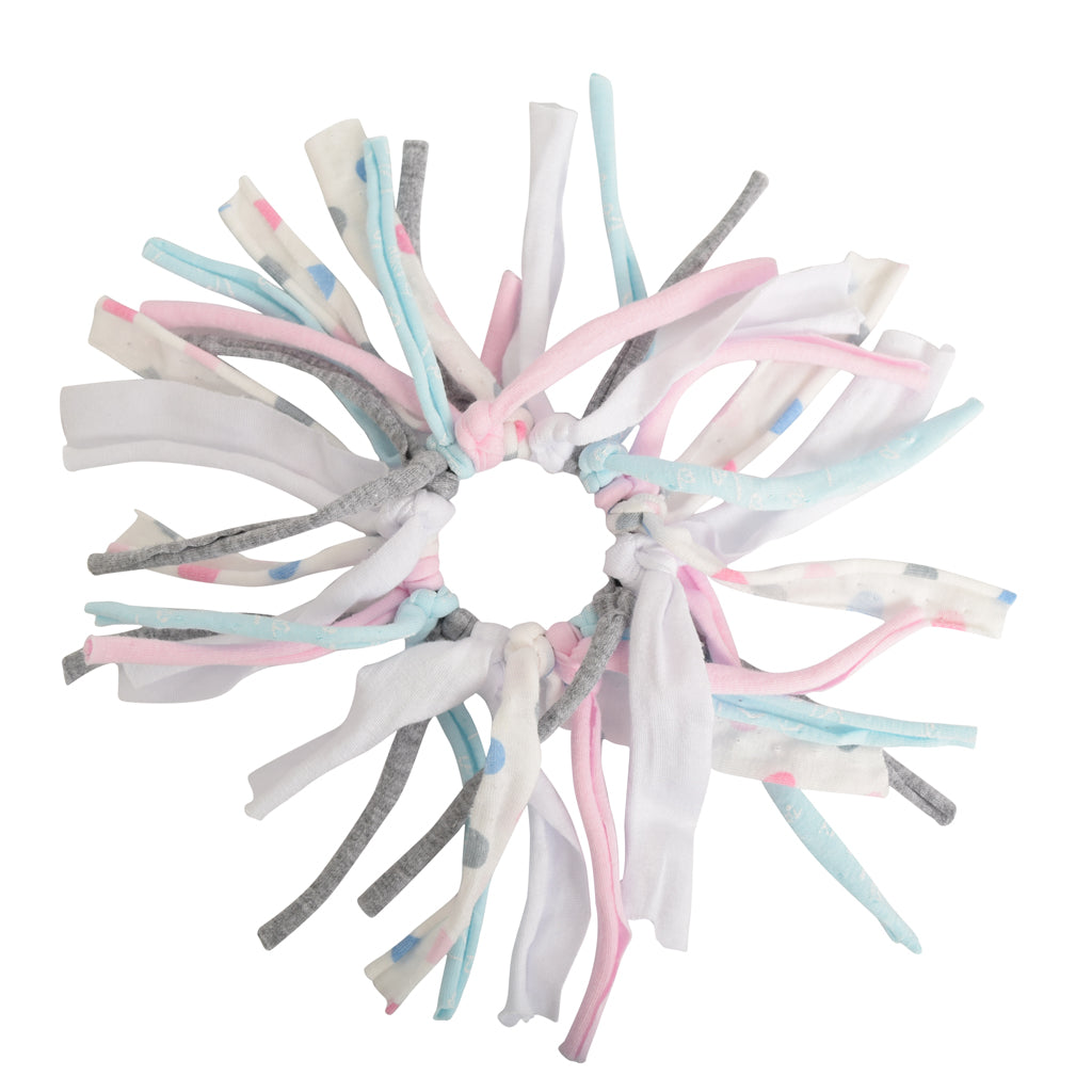 Eco DIY Scrunchie Kit featuring colorful upcycled materials and hair ties for crafting stylish scrunchies.