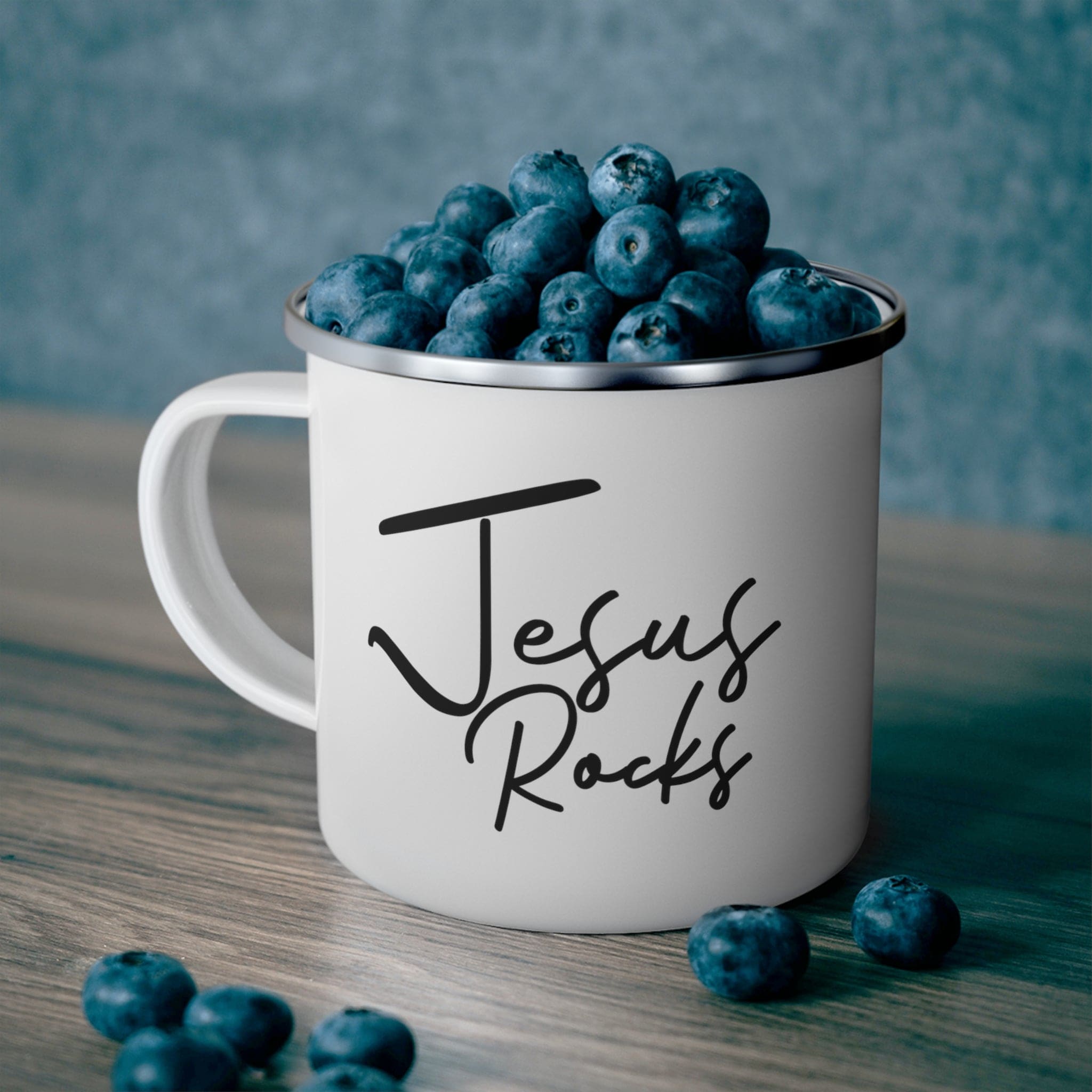 Durable enamel camping mug with 'Jesus Rocks' design, perfect for coffee and outdoor activities.