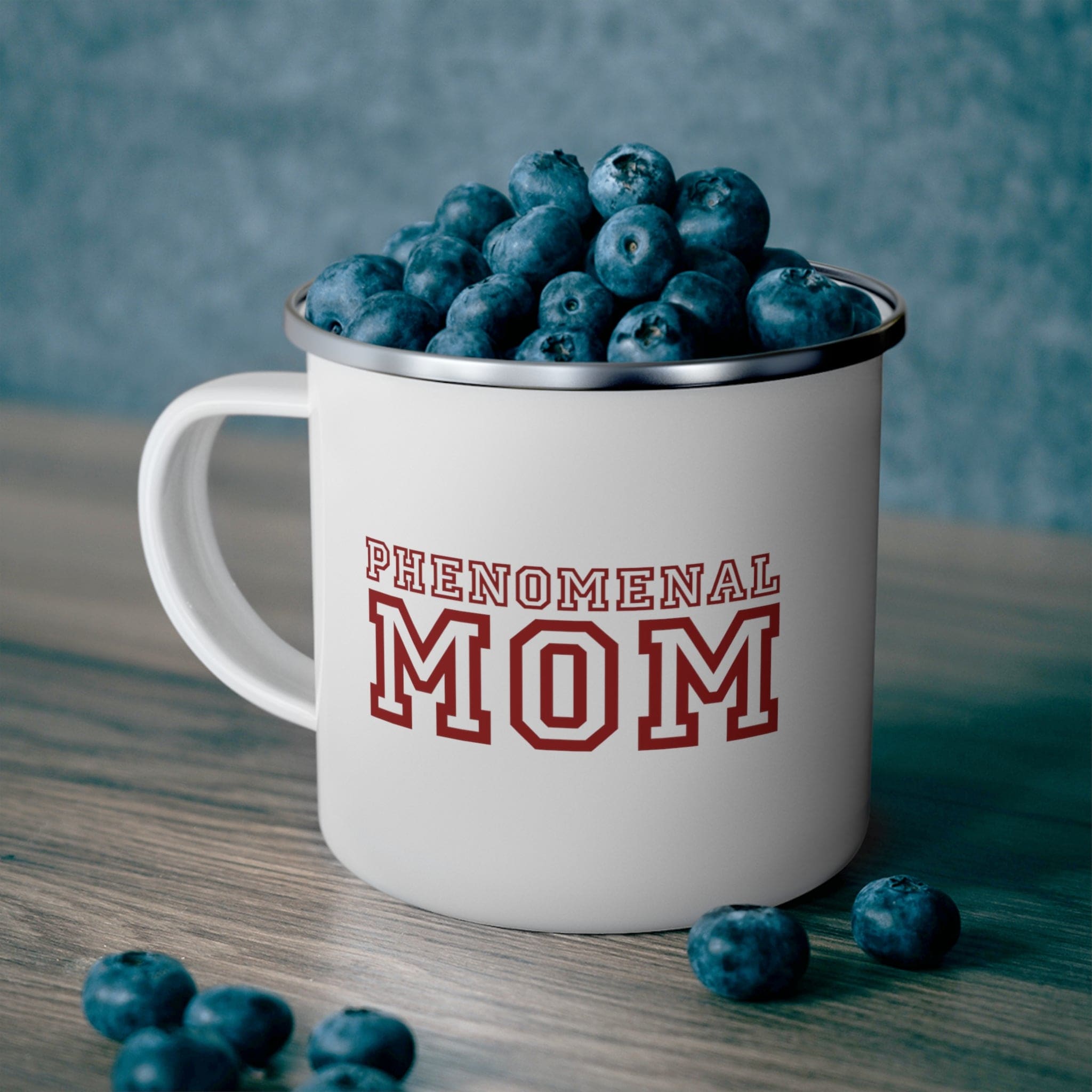 Red enamel camping mug with the phrase 'Phenomenal Mom', perfect for outdoor and indoor use.