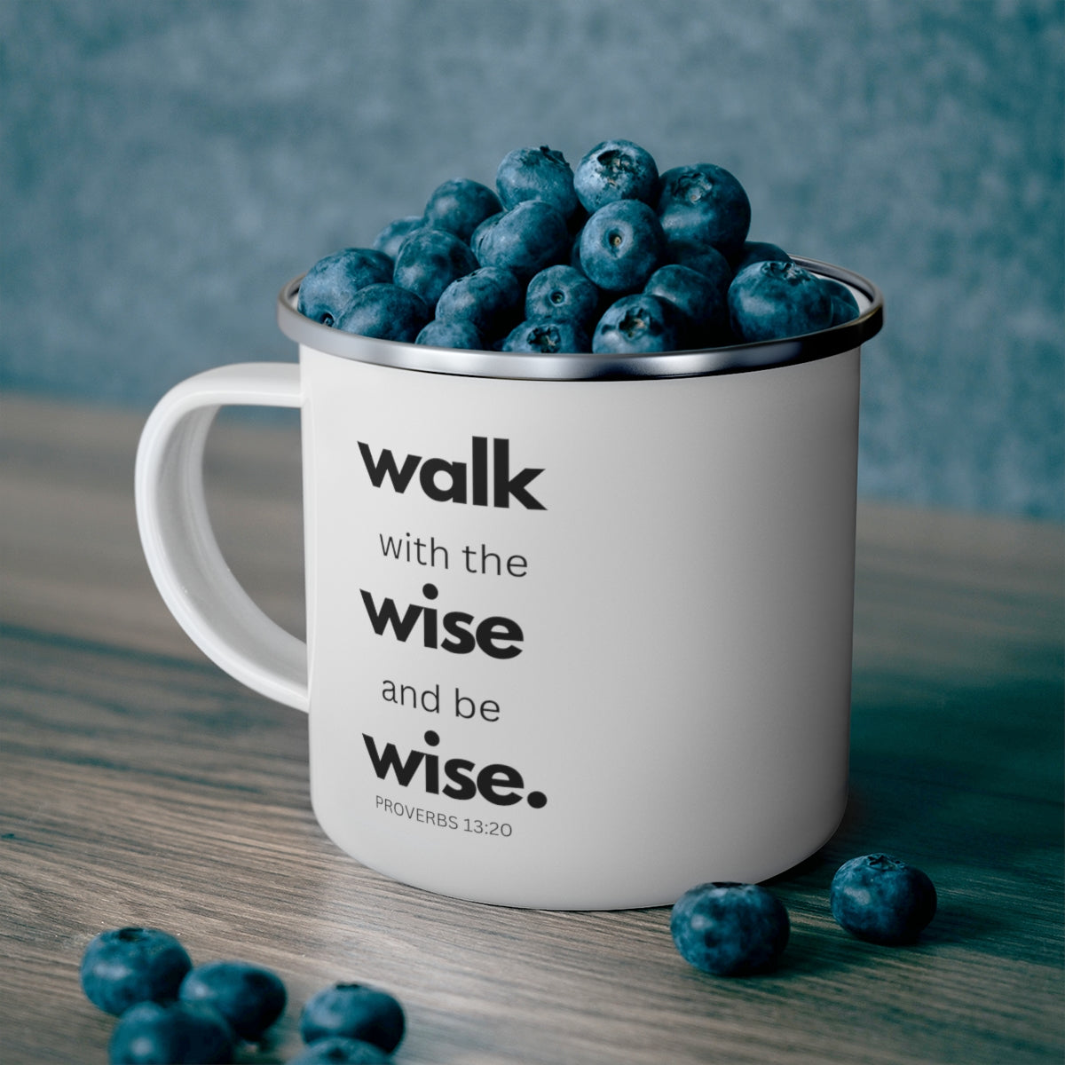 Durable enamel camping mug with black illustration, perfect for outdoor and indoor use.