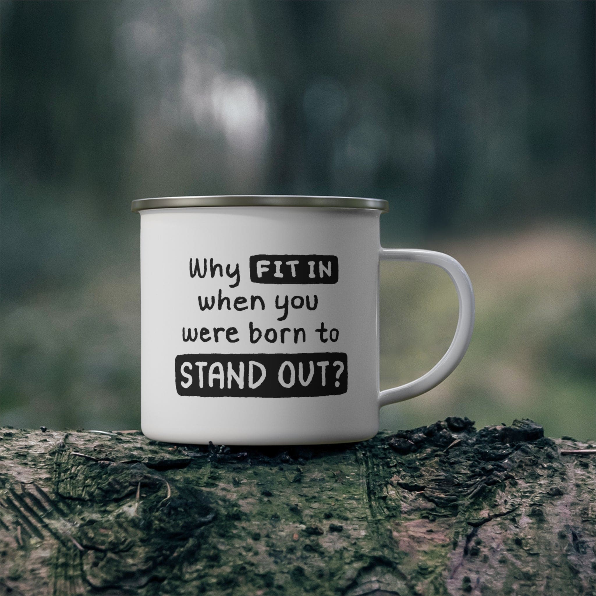 A stylish black enamel camping mug with rounded corners and a C-handle, featuring the phrase 'Why Fit In When You Were Born to Stand Out'.
