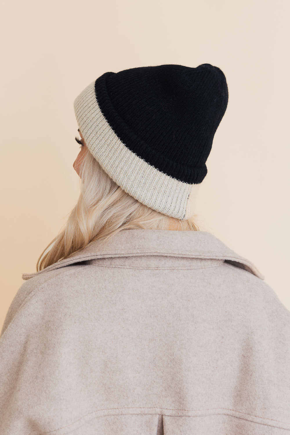 Essential Harmony Two-Tone Knit Beanie showcasing its stylish two-tone design and quality knit material.