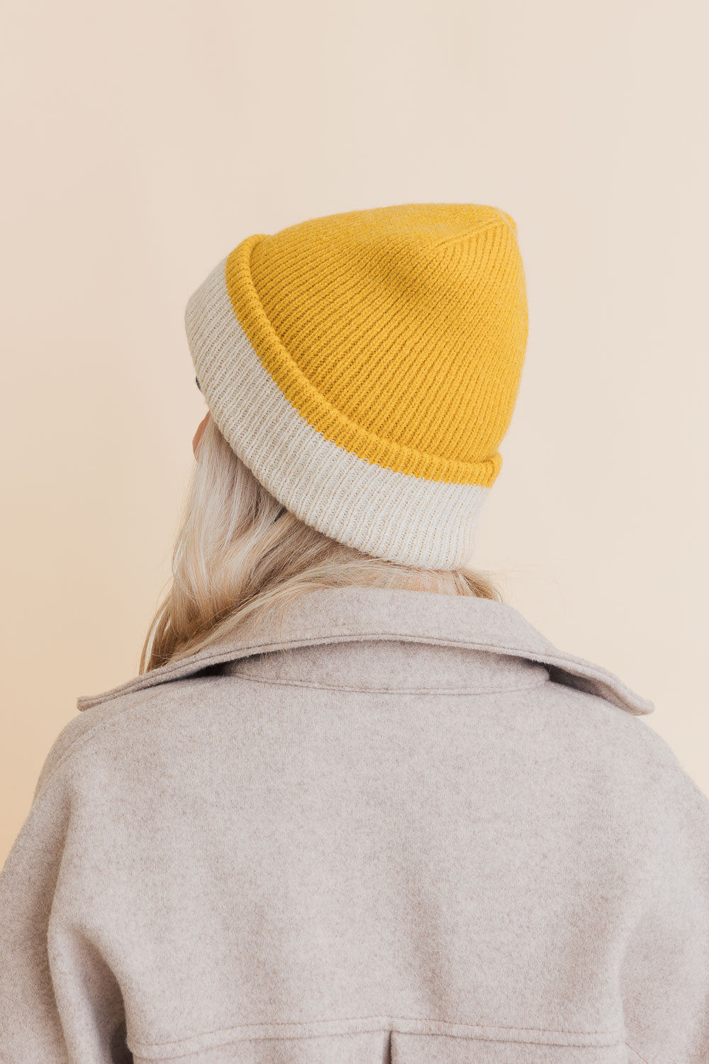 Essential Harmony Two-Tone Knit Beanie showcasing its stylish two-tone design and quality knit material.
