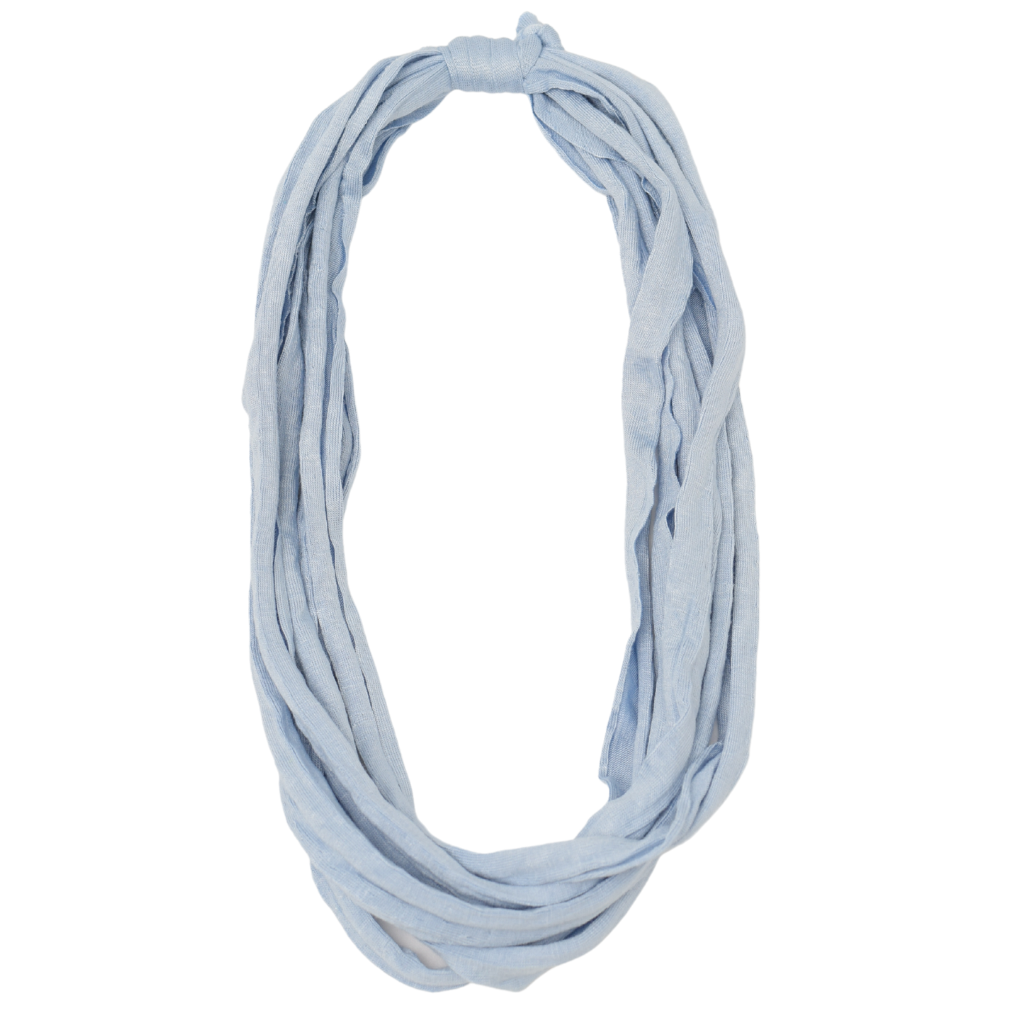 Essential Solid Bela Band Singles in various solid colors, showcasing their versatility as a headband and bracelet.