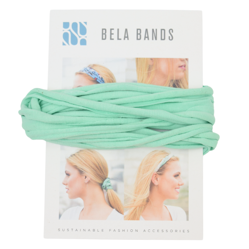 Essential Solid Bela Band Singles in various solid colors, showcasing their versatility as a headband and bracelet.