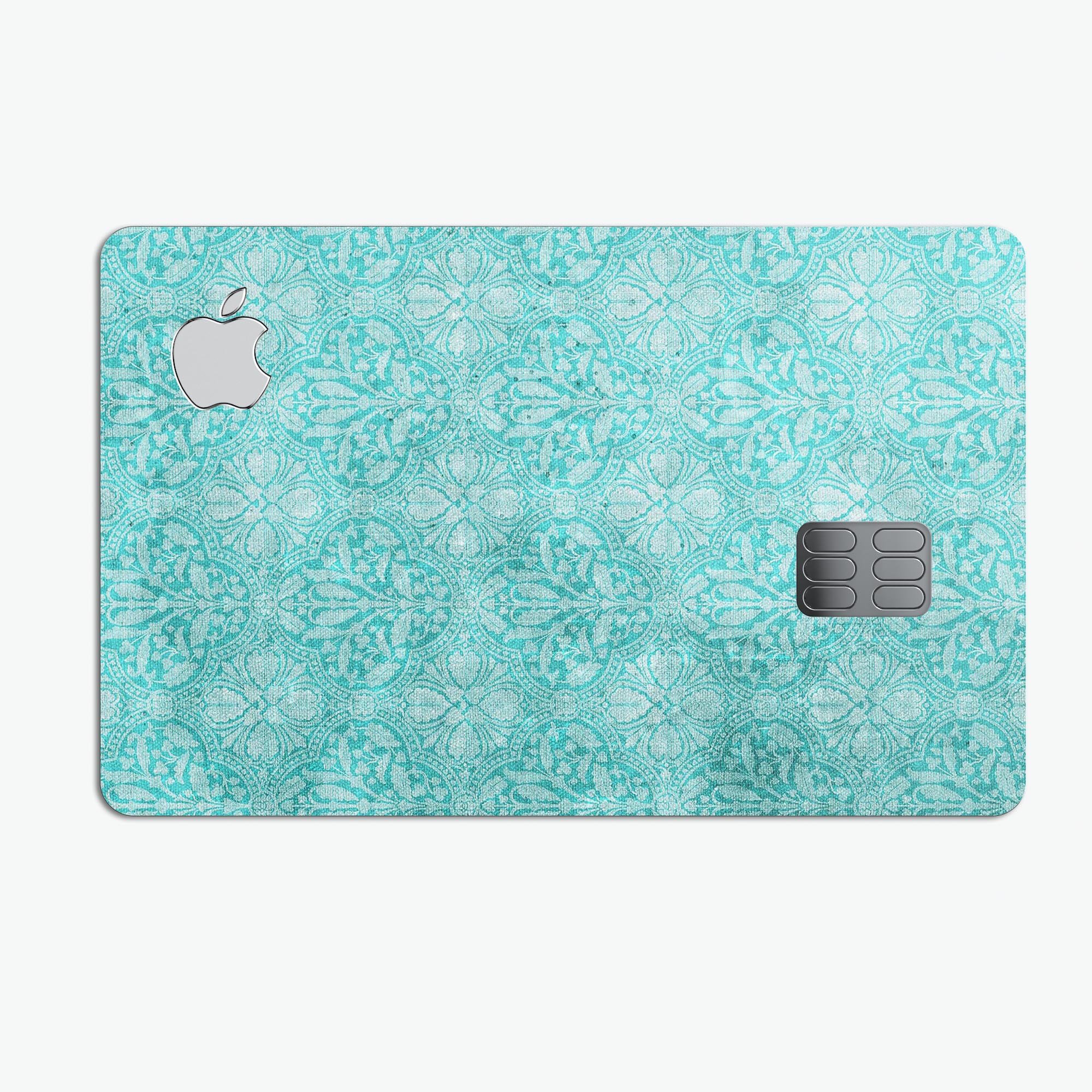 Faded teal and scratched royal surface protective decal for Apple Card, showcasing its premium vinyl material and stylish design.