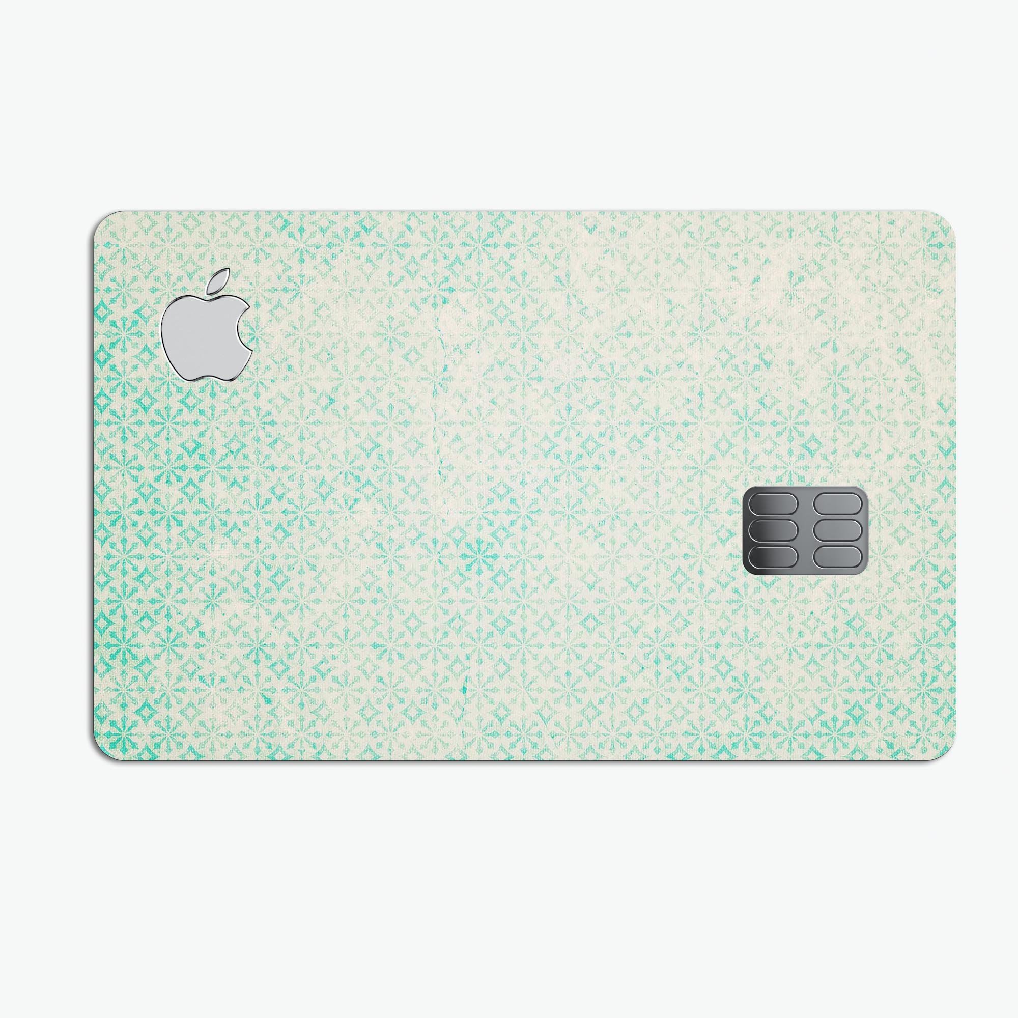 Faded teal snowflake pattern protective decal skin for Apple Card, showcasing its vibrant design and premium quality.