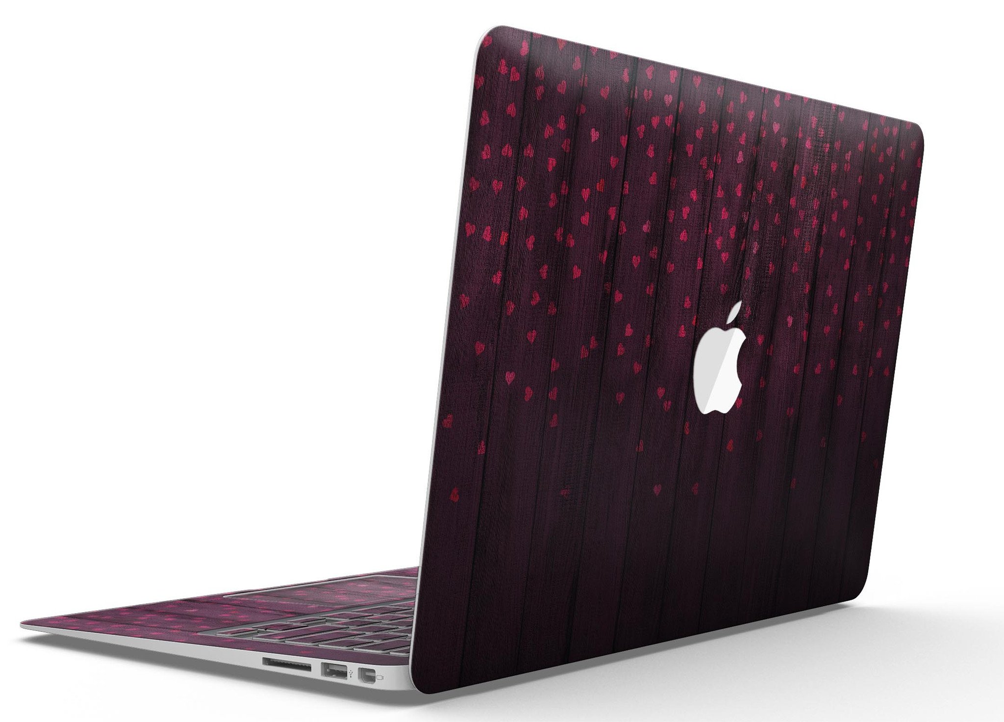 Falling Micro Hearts design on burgundy wood planks MacBook Air skin, showcasing vibrant colors and premium vinyl material.