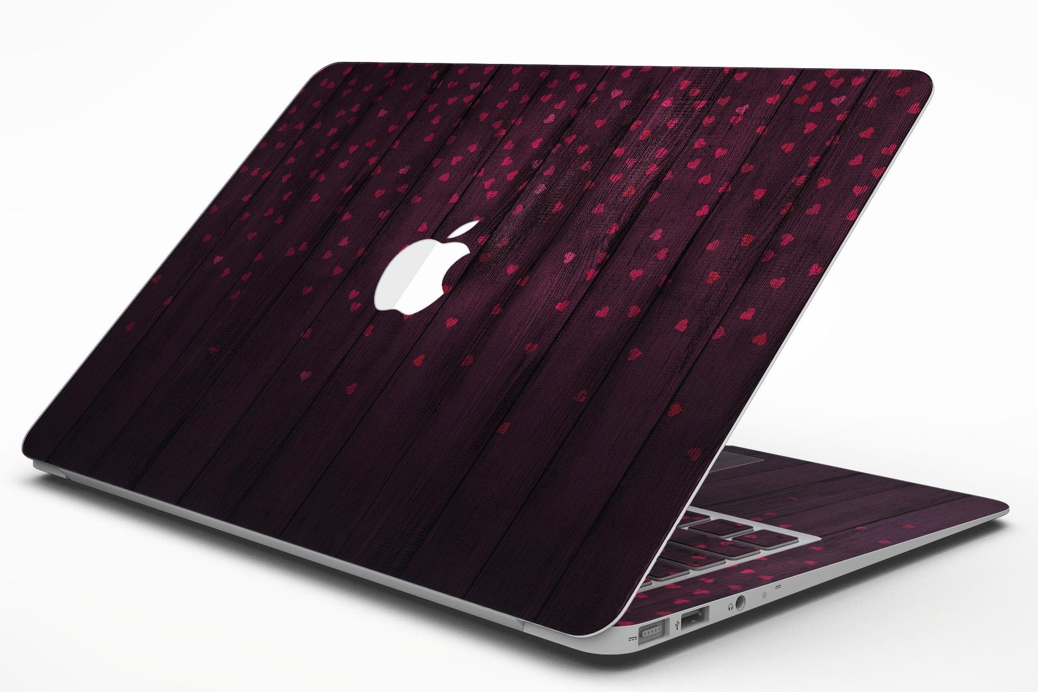 Falling Micro Hearts design on burgundy wood planks MacBook Air skin, showcasing vibrant colors and premium vinyl material.