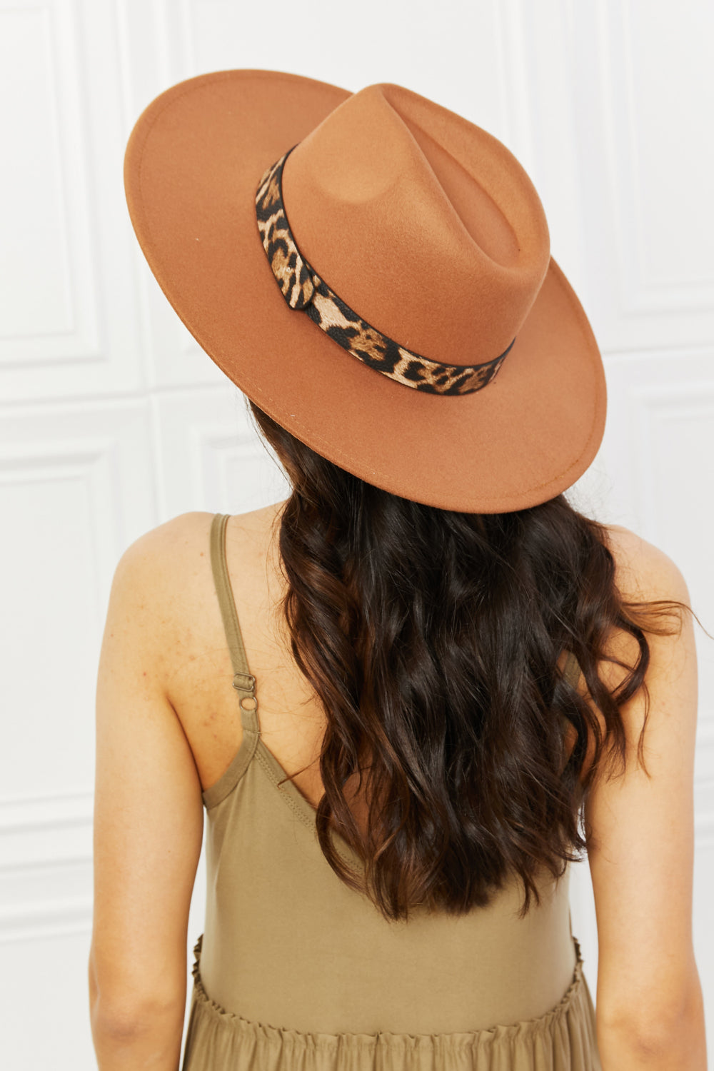 Fame In The Wild Leopard Detail Fedora Hat showcasing a stylish leopard pattern and adjustable straps, perfect for any outfit.
