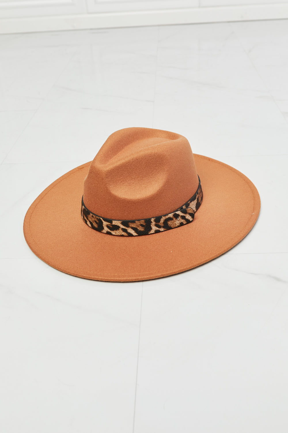 Fame In The Wild Leopard Detail Fedora Hat showcasing a stylish leopard pattern and adjustable straps, perfect for any outfit.