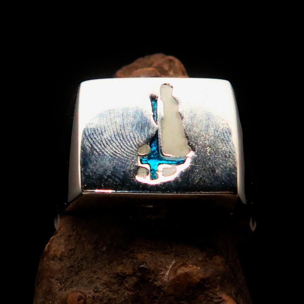 A stunning sterling silver pinky ring featuring the Flag of Finland, polished to a mirror finish with the RCRN Logo.