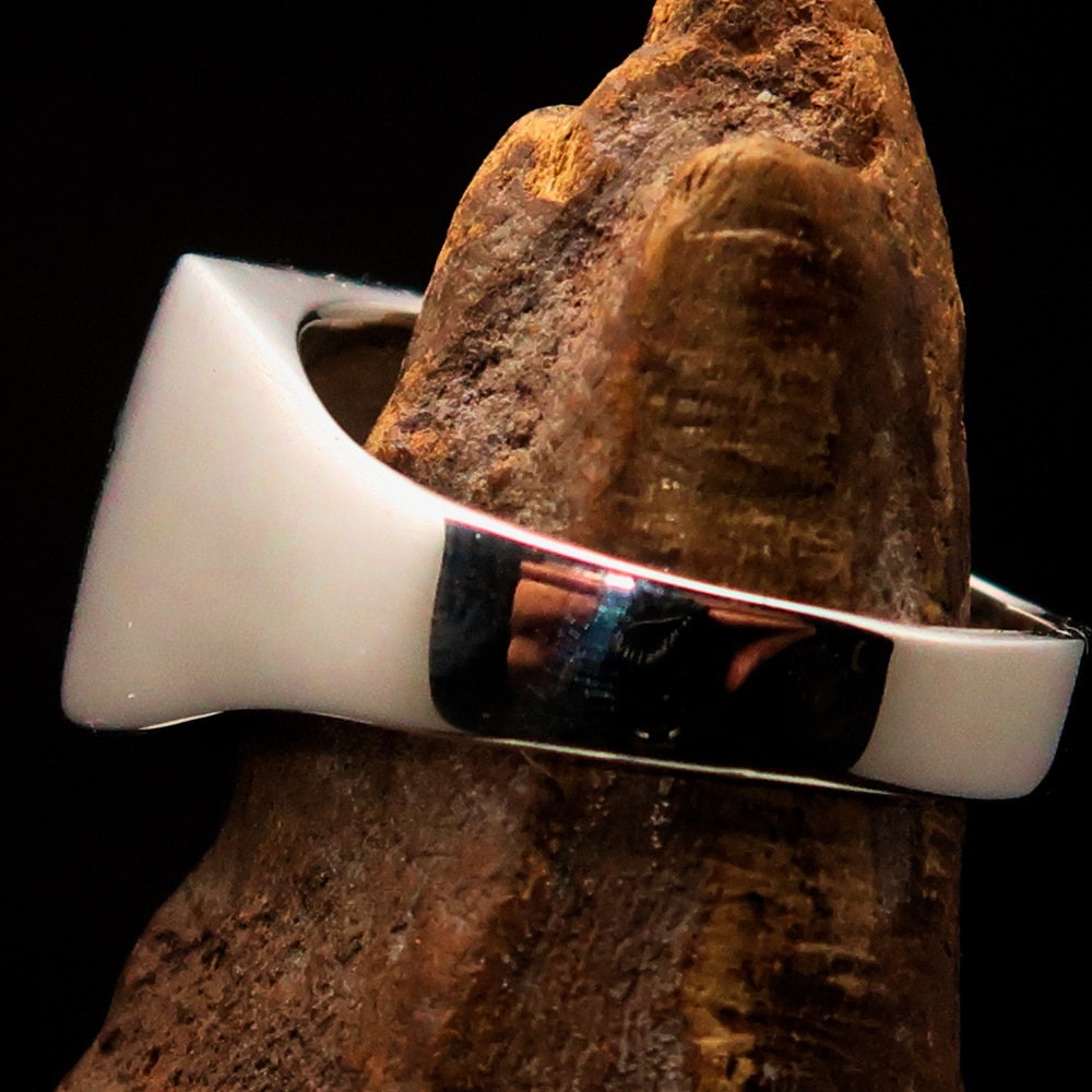 A stunning sterling silver pinky ring featuring the Flag of Finland, polished to a mirror finish with the RCRN Logo.