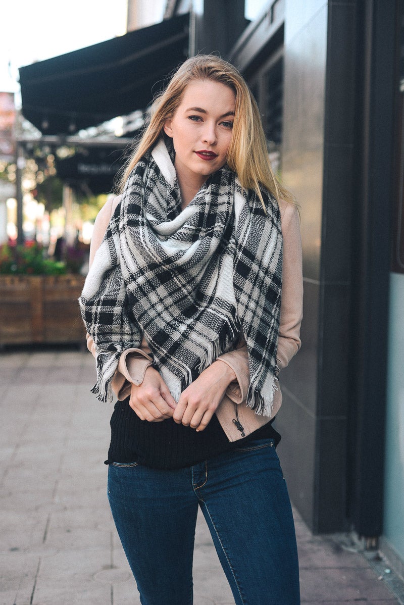 A cozy Flannel Frayed Edge Blanket Scarf in a stylish design, showcasing its soft texture and frayed edges.
