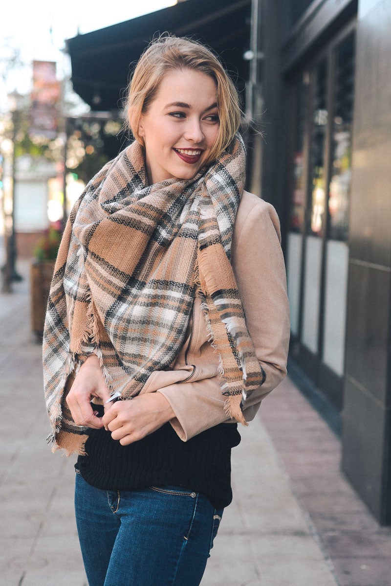 A cozy Flannel Frayed Edge Blanket Scarf in a stylish design, showcasing its soft texture and frayed edges.
