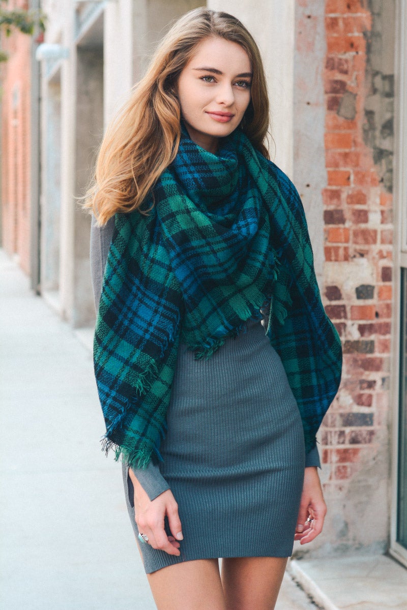 A cozy Flannel Frayed Edge Blanket Scarf in a stylish design, showcasing its soft texture and frayed edges.