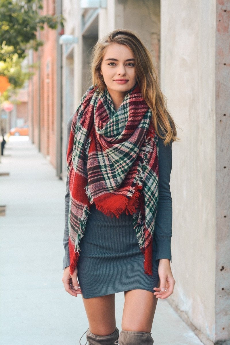 A cozy Flannel Frayed Edge Blanket Scarf in a stylish design, showcasing its soft texture and frayed edges.