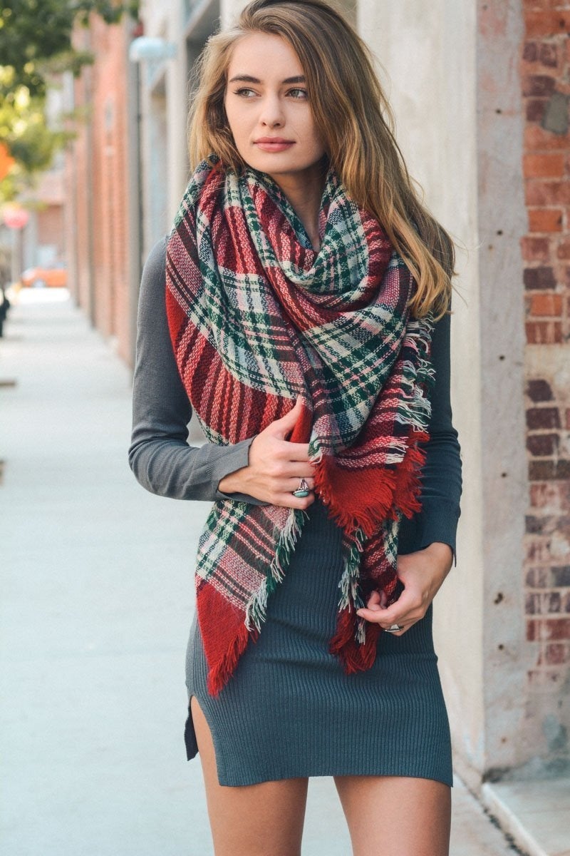 A cozy Flannel Frayed Edge Blanket Scarf in a stylish design, showcasing its soft texture and frayed edges.