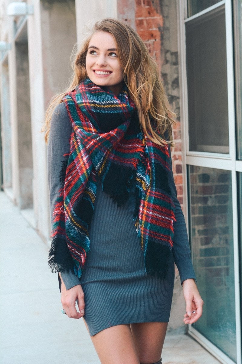 A cozy Flannel Frayed Edge Blanket Scarf in a stylish design, showcasing its soft texture and frayed edges.
