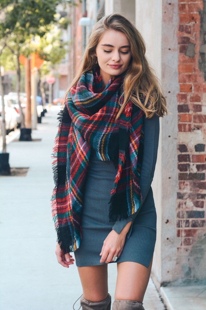 A cozy Flannel Frayed Edge Blanket Scarf in a stylish design, showcasing its soft texture and frayed edges.