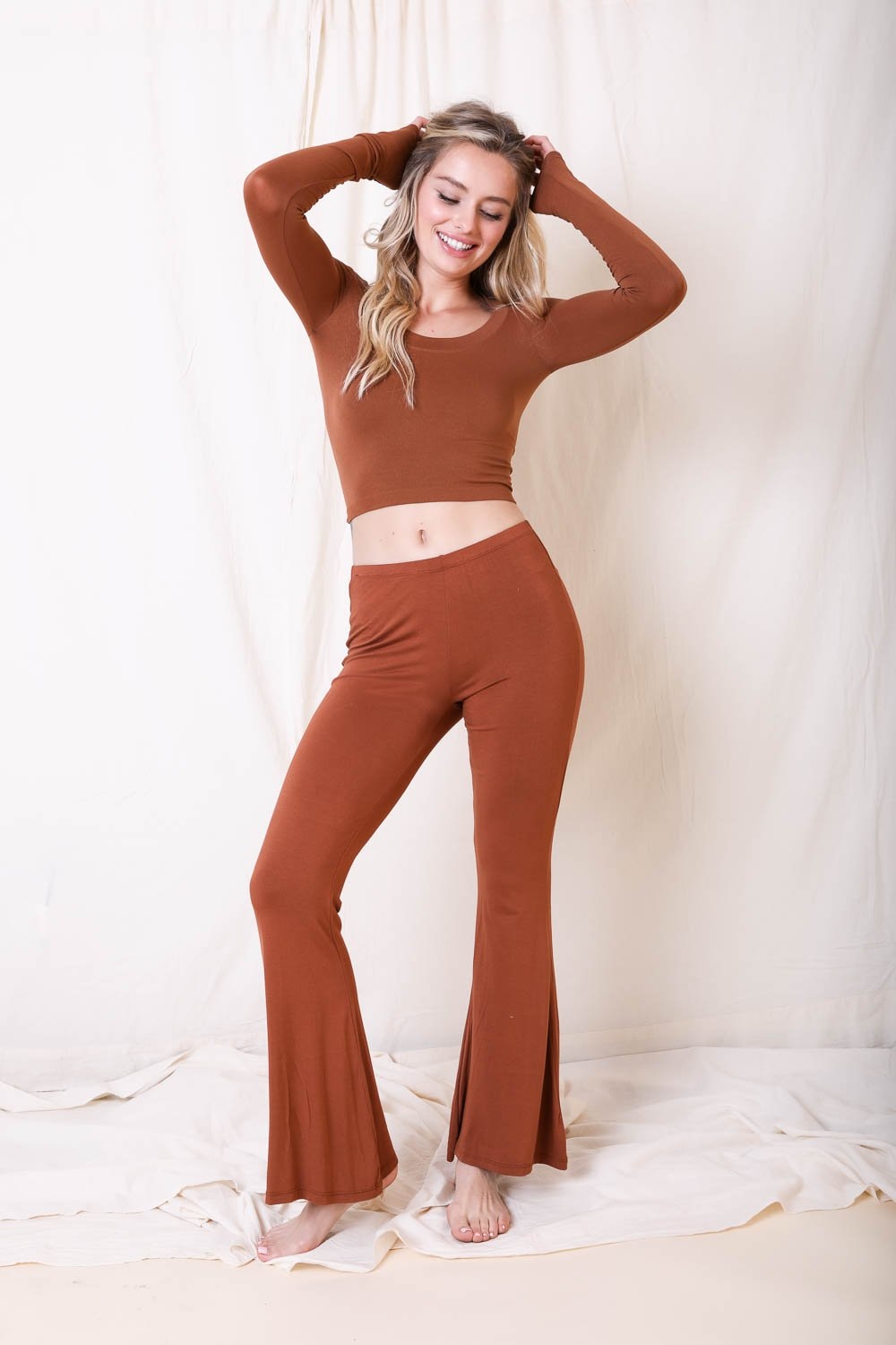 Trendy flared lounge pants made of lightweight stretchy fabric, perfect for casual outings and lounging at home.