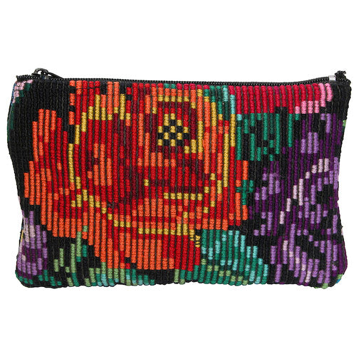 Floral Huipil Zippered Pouch handcrafted from recycled textiles, showcasing vibrant colors and unique patterns.
