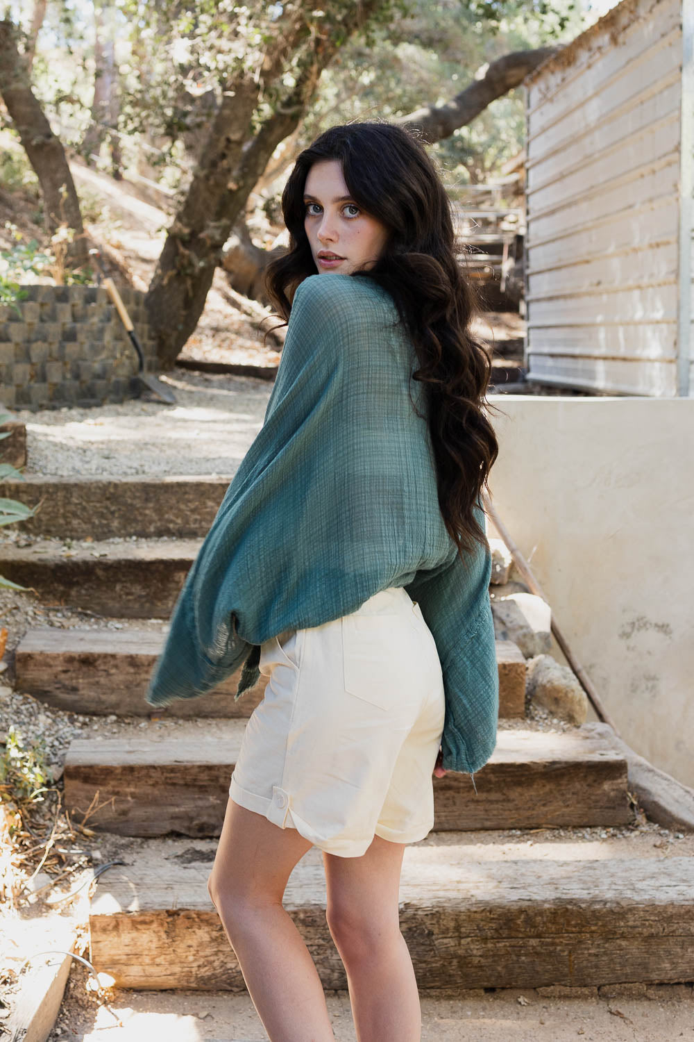 A stylish Flounce Tie-Front Kimono Wrap featuring a lightweight fabric, feminine tie-front closure, and comfortable kimono sleeves, perfect for layering.