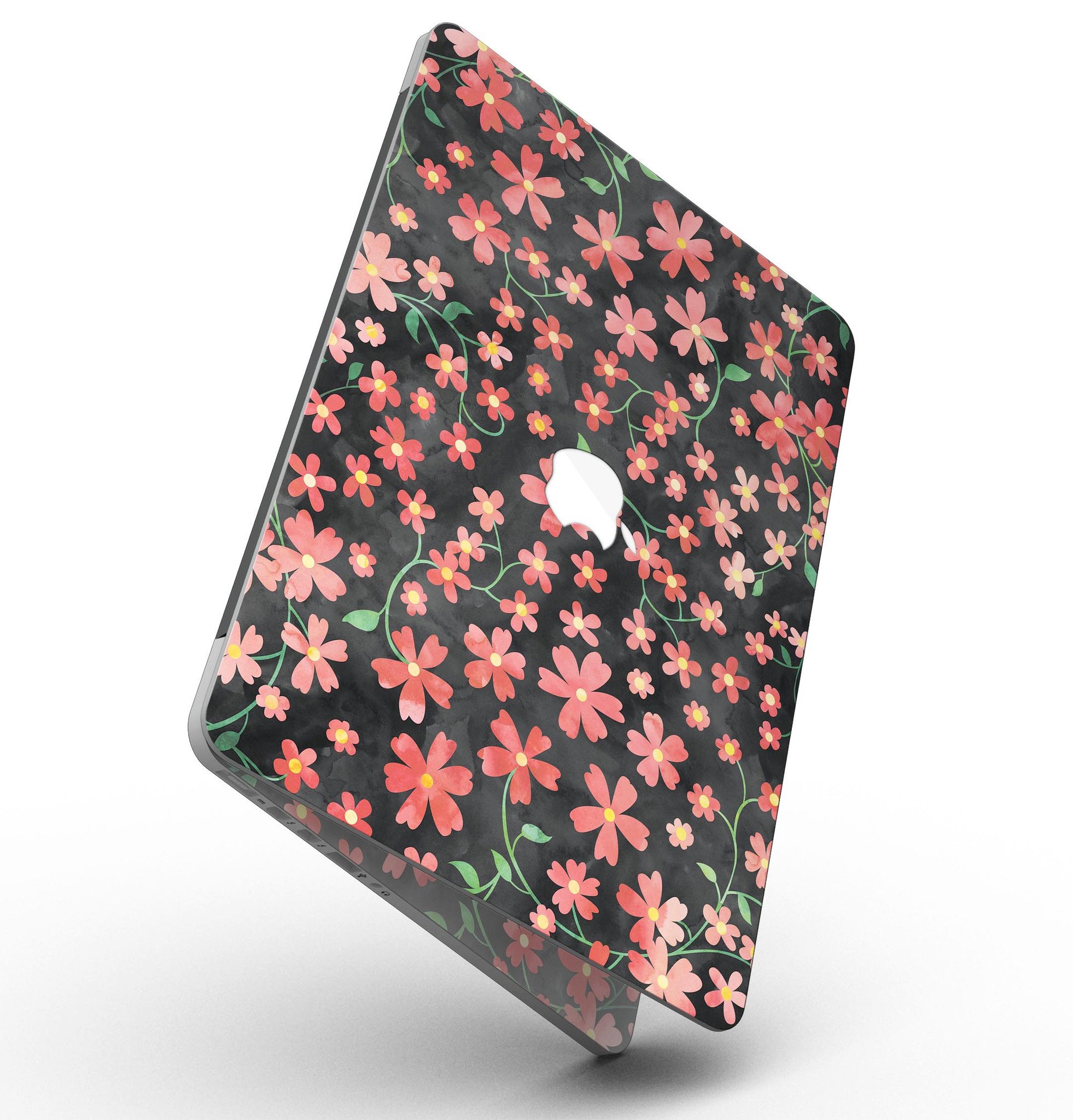 A MacBook Pro with Retina Display featuring a vibrant Flowers with Stems design skin, showcasing floral patterns over a black watercolor background.