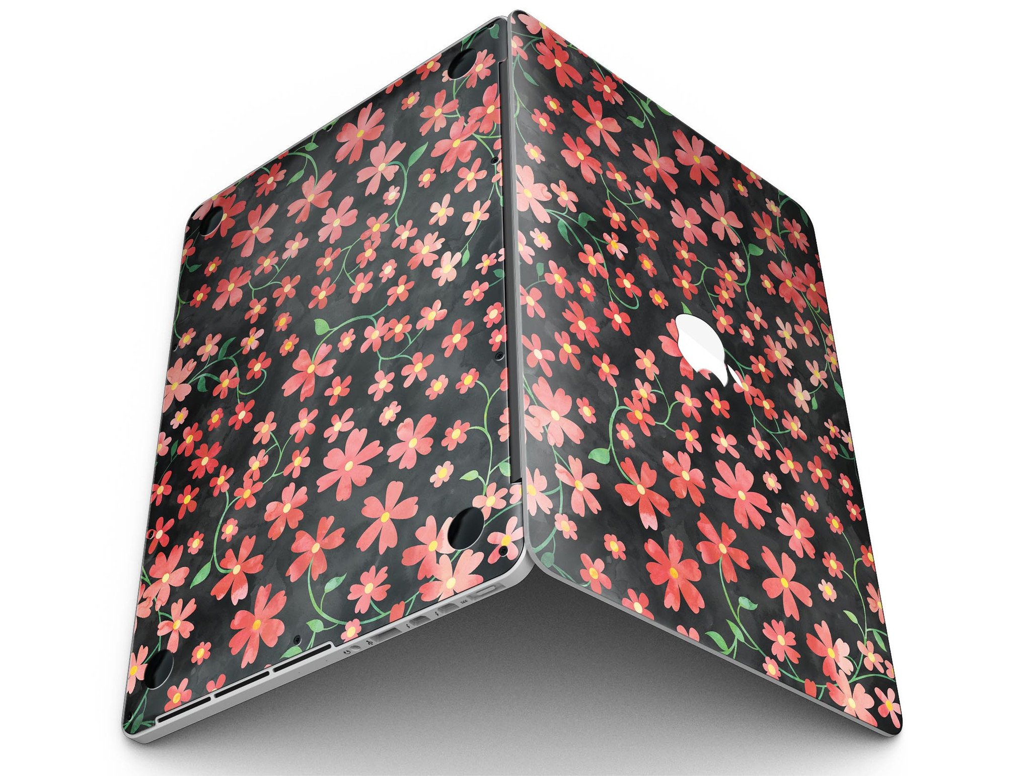 A MacBook Pro with Retina Display featuring a vibrant Flowers with Stems design skin, showcasing floral patterns over a black watercolor background.