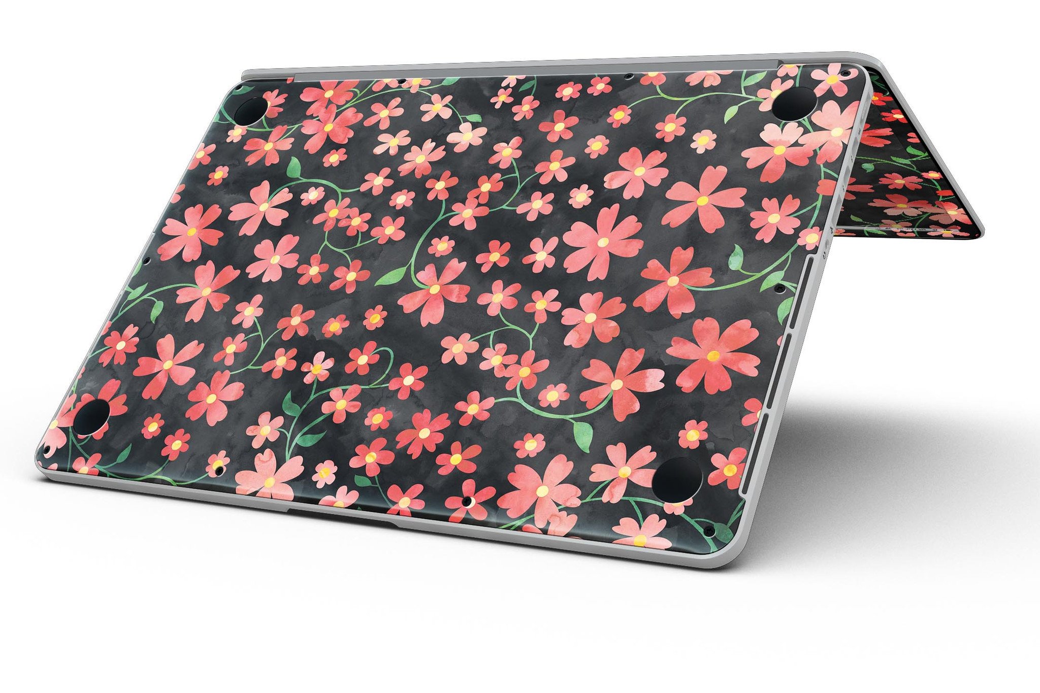 A MacBook Pro with Retina Display featuring a vibrant Flowers with Stems design skin, showcasing floral patterns over a black watercolor background.