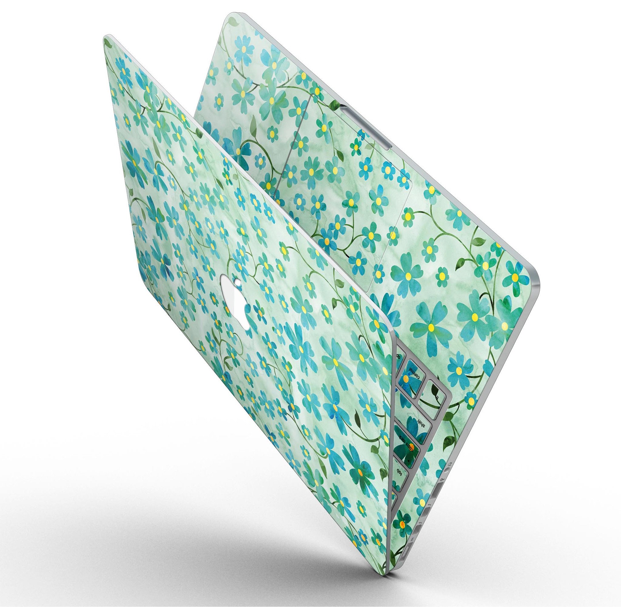 A MacBook Pro with a floral skin featuring flowers and stems over a light green watercolor background, showcasing its stylish design.
