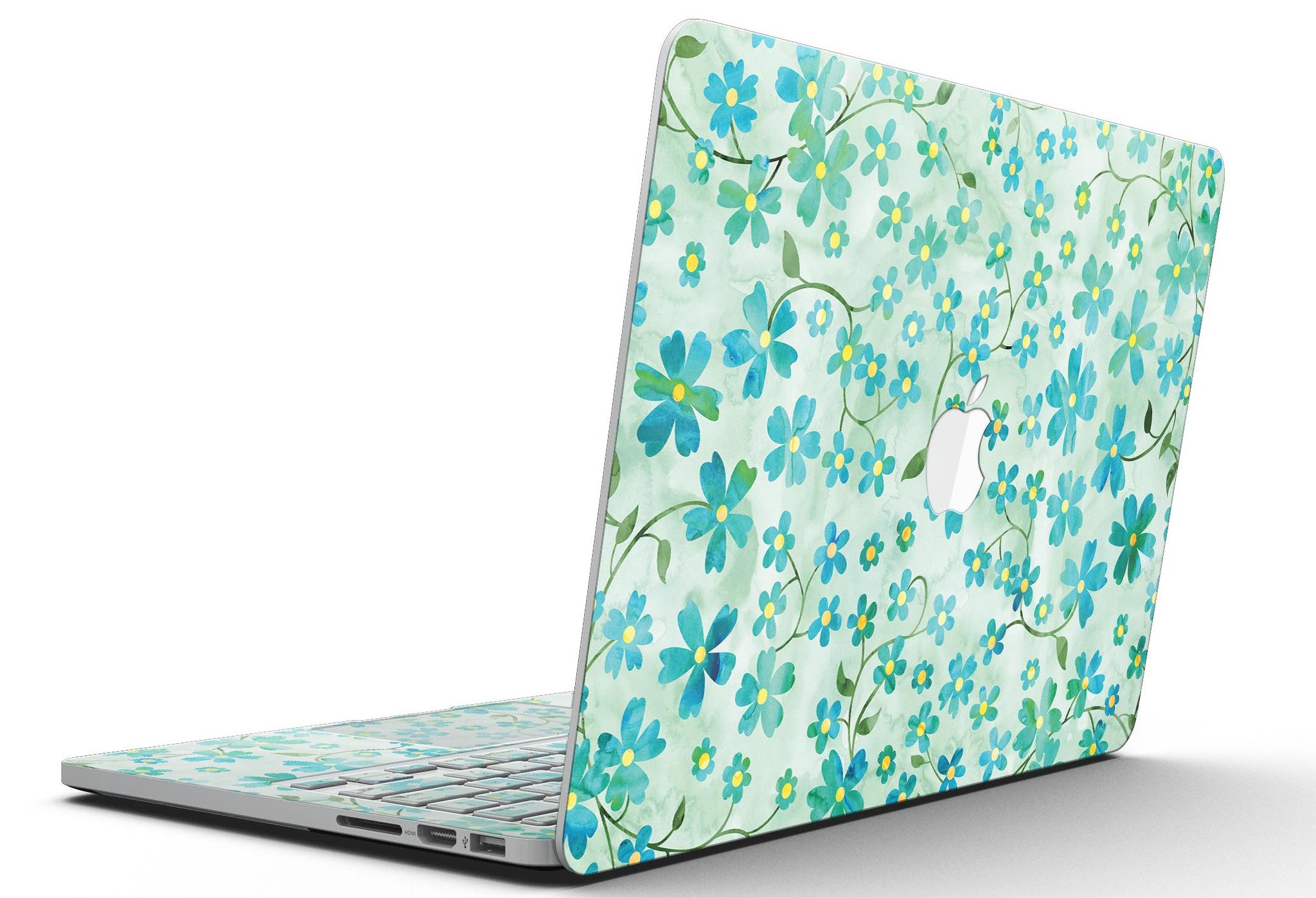 A MacBook Pro with a floral skin featuring flowers and stems over a light green watercolor background, showcasing its stylish design.