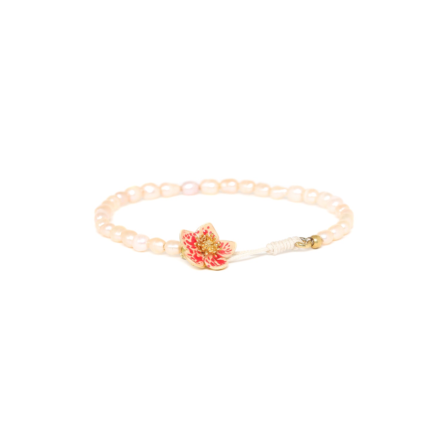 Franck Herval Dafne Button Stretch Bracelet featuring vibrant orange flowers on a stretch band, showcasing a romantic and natural design.