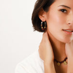Franck Herval Kara Creole Earring featuring garnet and labradorite stones in an ethnic chic design.
