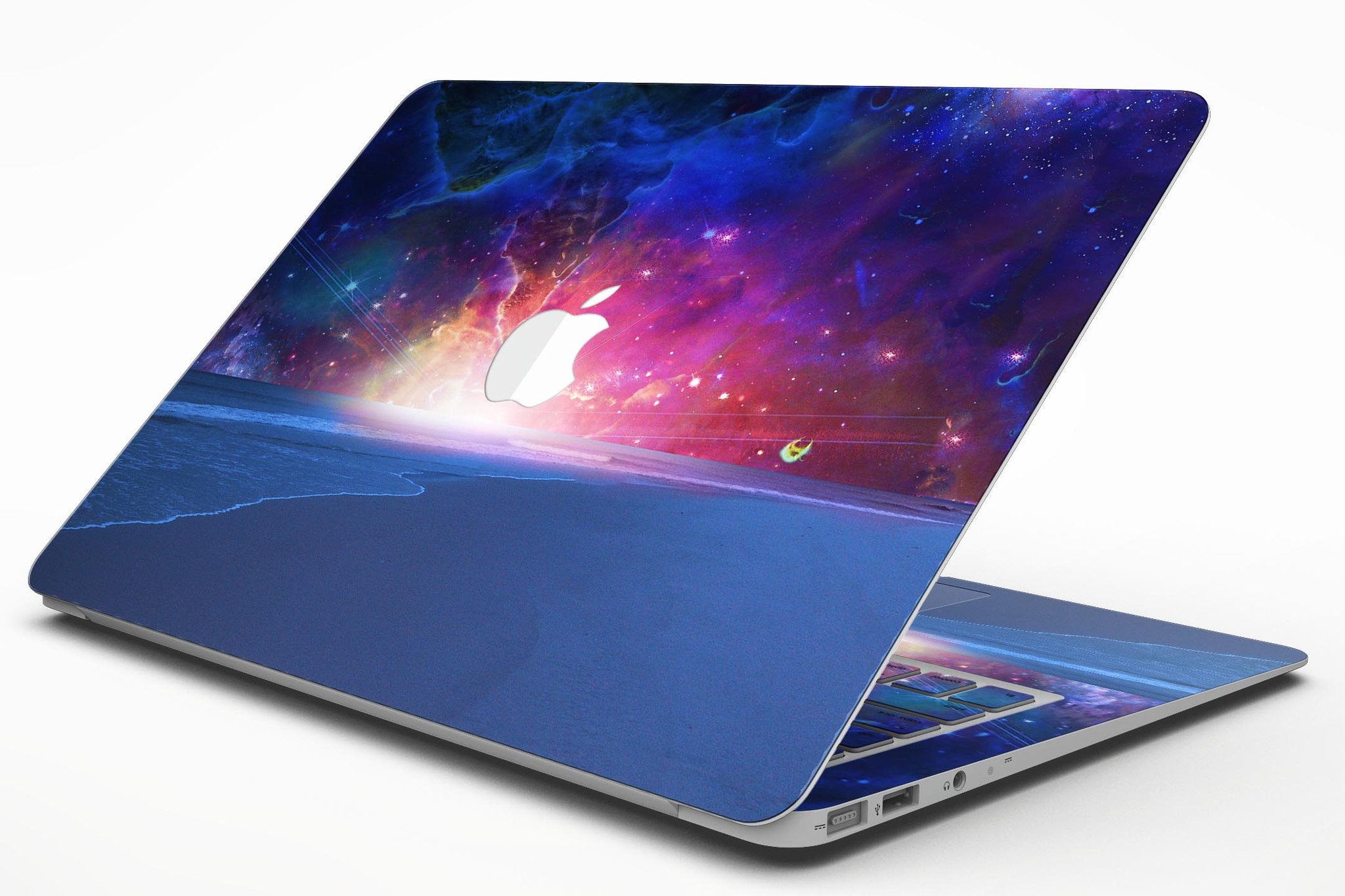 Galaxy Explosion design skin kit for MacBook Air, showcasing vibrant colors and patterns over a calm sea shore.