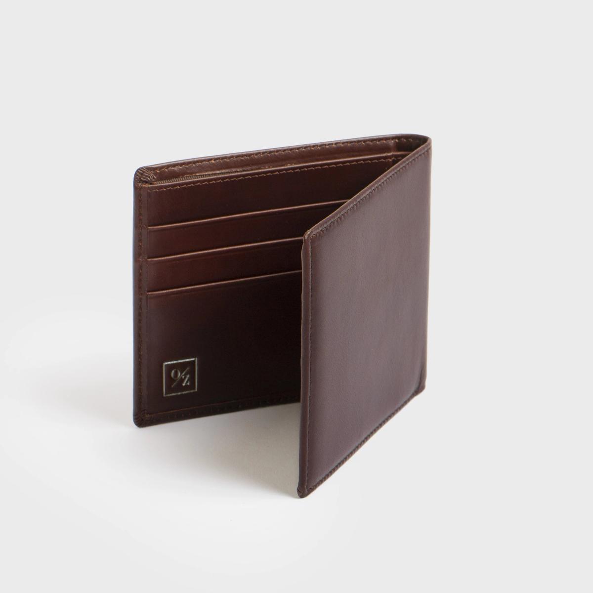 Genuine Leather Men’s Luxury Bi-Fold Wallet showcasing its elegant design and multiple pockets.