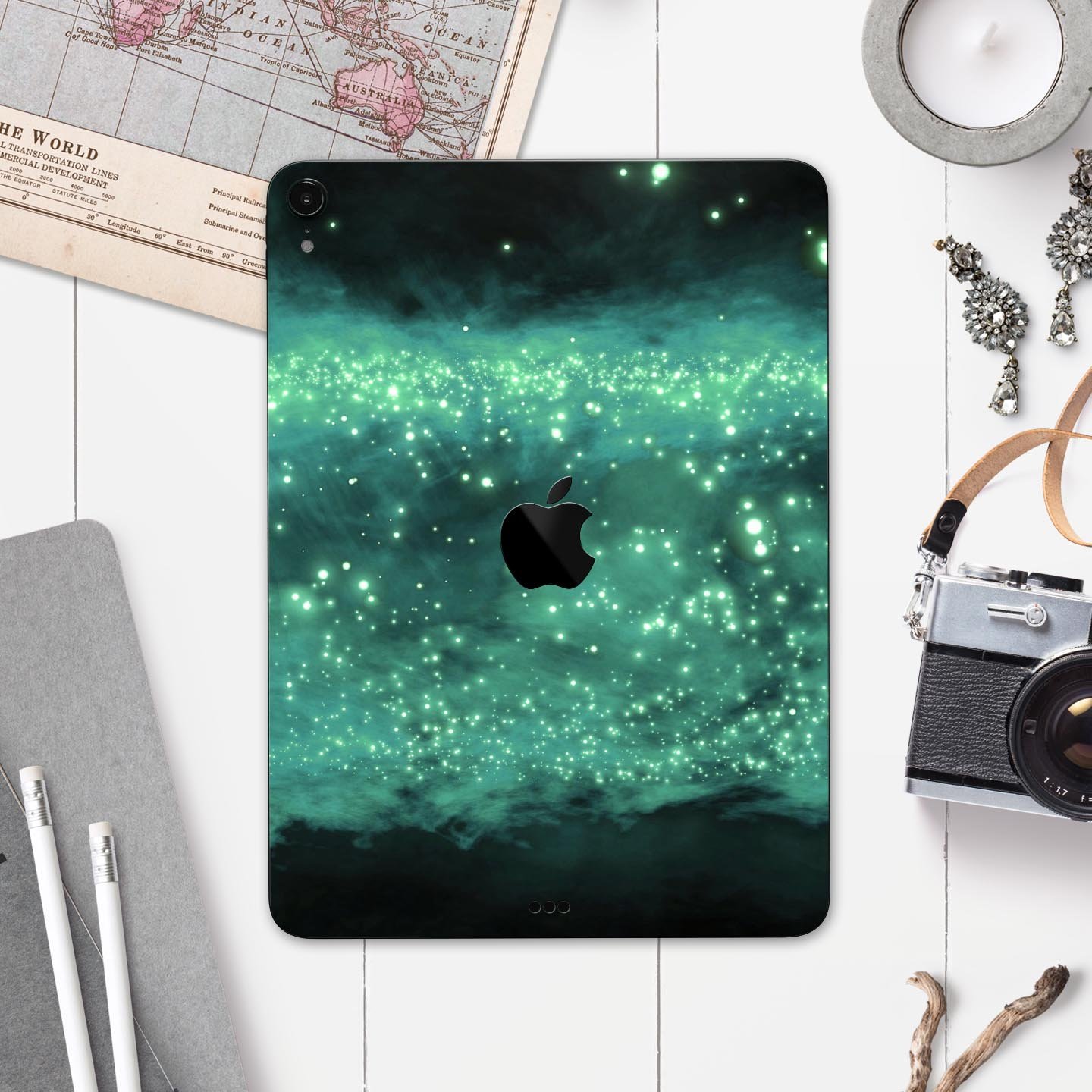 Glowing Green Orbs of Light skin decal applied on an Apple iPad, showcasing vibrant colors and sleek design.