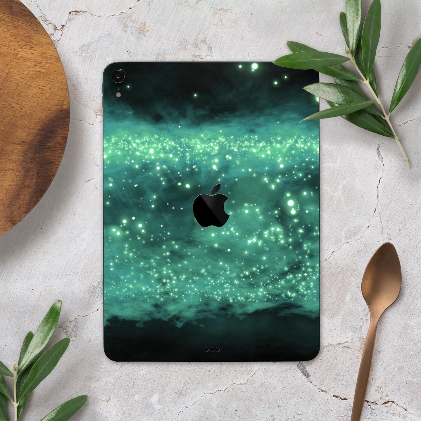 Glowing Green Orbs of Light skin decal applied on an Apple iPad, showcasing vibrant colors and sleek design.