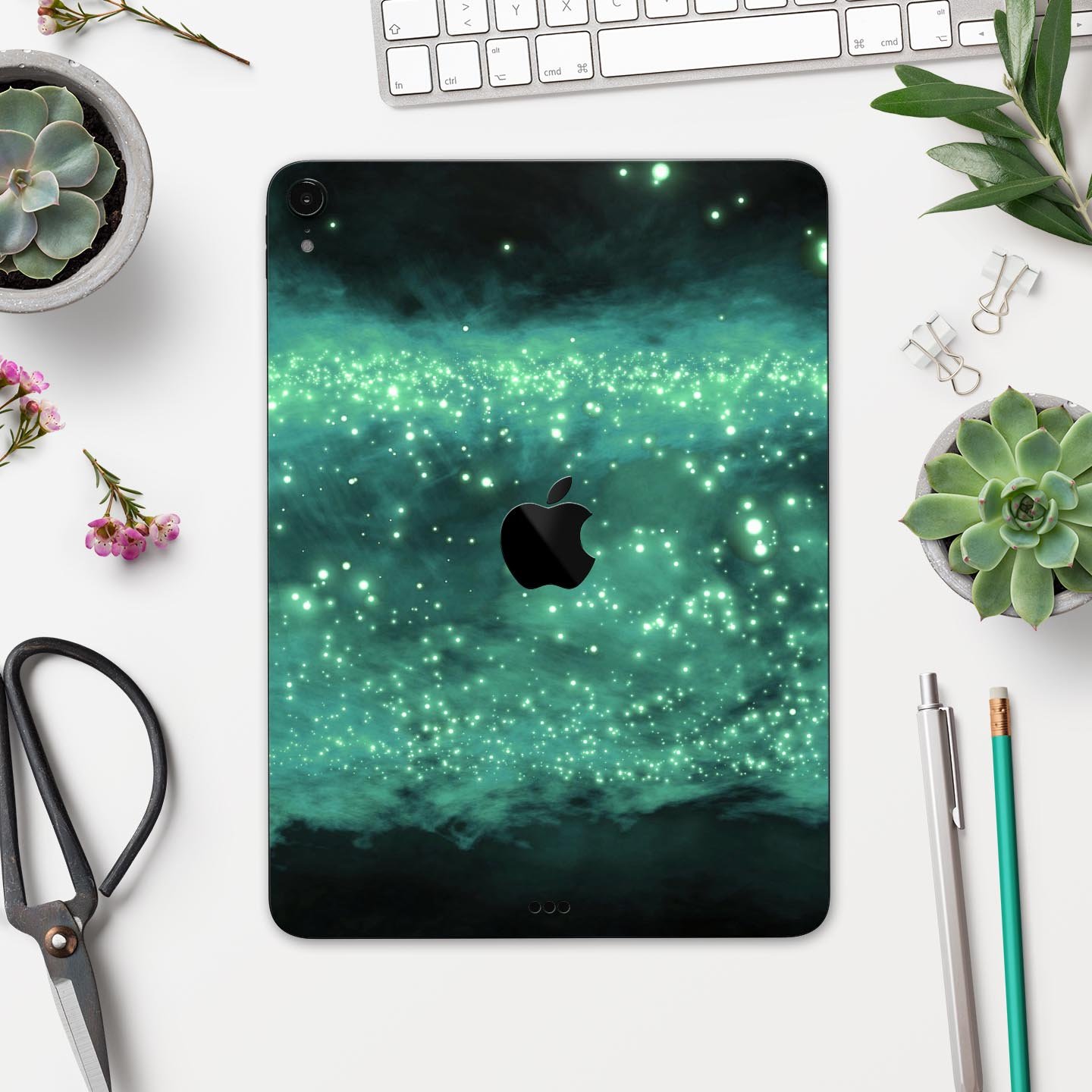 Glowing Green Orbs of Light skin decal applied on an Apple iPad, showcasing vibrant colors and sleek design.