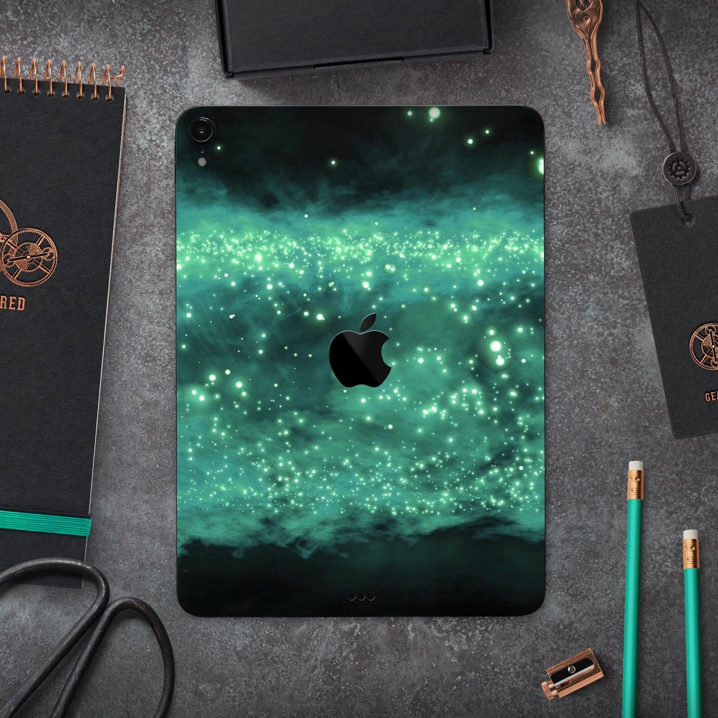 Glowing Green Orbs of Light skin decal applied on an Apple iPad, showcasing vibrant colors and sleek design.