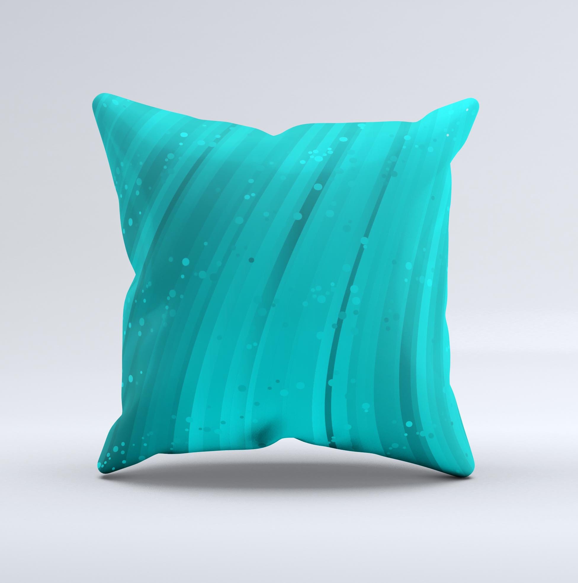 Glowing teal abstract waves decorative throw pillow with intricate ink-fuzed design, showcasing vibrant colors and unique handcrafted details.